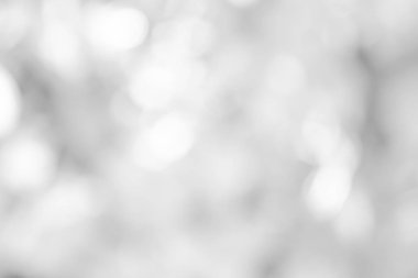 Beyaz bulanık arkaplan. Bokeh Noel 'i güzel, parlak Noel ışıklarını bulanıklaştırdı