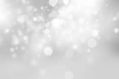 Beyaz ve gri soyut arkaplan. Bokeh Noel 'i güzel, parlak Noel ışıklarını bulanıklaştırdı