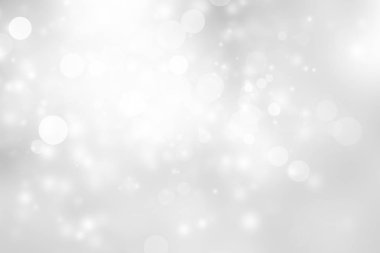 Beyaz ve gri soyut arkaplan. Bokeh Noel 'i güzel, parlak Noel ışıklarını bulanıklaştırdı