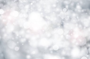 Beyaz ve gri soyut arkaplan. Bokeh Noel 'i güzel, parlak Noel ışıklarını bulanıklaştırdı