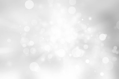 Beyaz ve gri soyut arkaplan. Bokeh Noel 'i güzel, parlak Noel ışıklarını bulanıklaştırdı