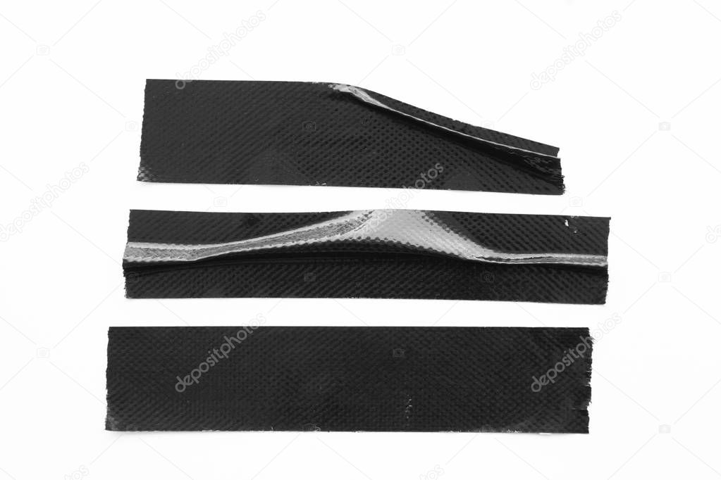 Set of black tapes on white background. Torn horizontal and different size black sticky tape, adhesive pieces.