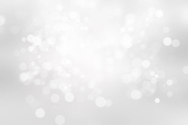 Beyaz ve gri kar, soyut arkaplanı bulanıklaştırdı. Bokeh Noel 'i güzel, parlak Noel ışıklarını bulanıklaştırdı