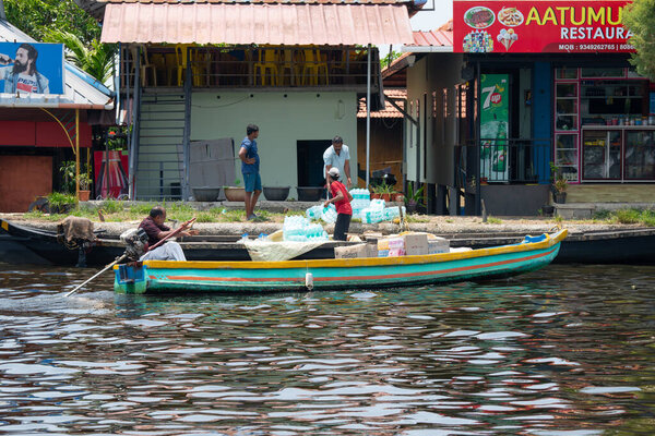 Alleppey backwaters India, Alappuzha boat brings drinks to supermarket on waterway, small canal of Laccadive Sea, Tarshish land, Kerala, serene water, march 26th 2025
