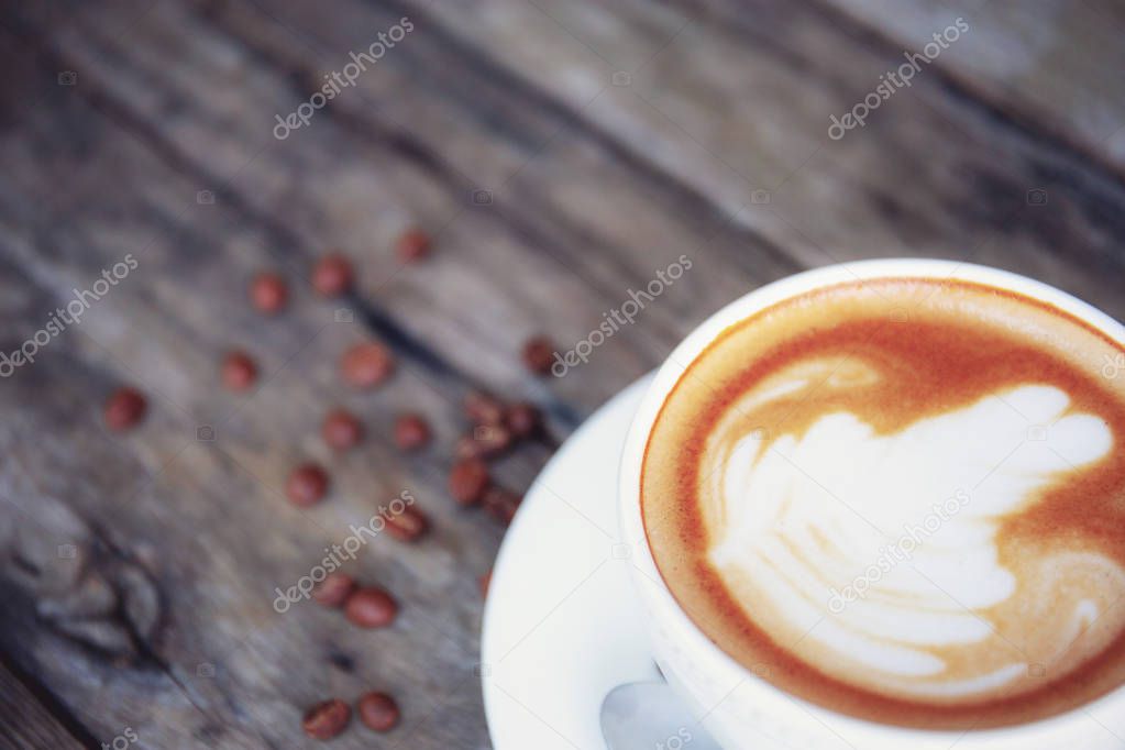 Coofee cup on wooden with texture background.
