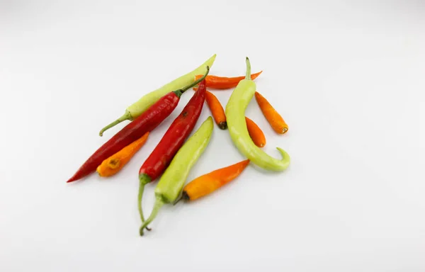 Green chili, red chili, yellow chili paste on white background.