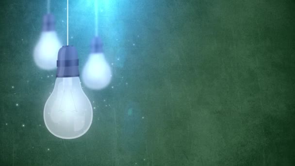 Glödande glödlampa lökar faller ner hängande på sträng grön bakgrund — Stockvideo