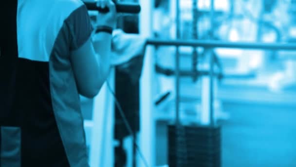 Woman exercising with a weight tower. Fitness woman working out on core muscles at cross fit gym. — Stock Video