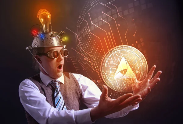 Distraught looking conspiracy believer in suit with aluminum foil head with AMMBR cryotocurrency coin — Stock Photo, Image