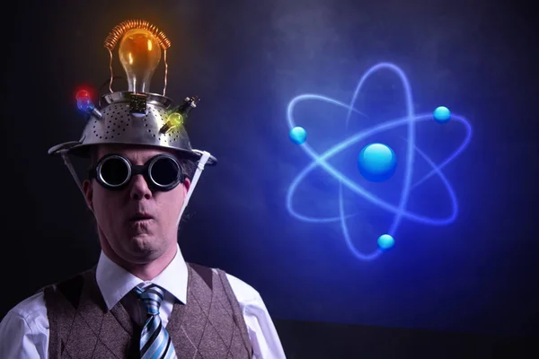 Nerd with tin foil hat presenting Atom icon