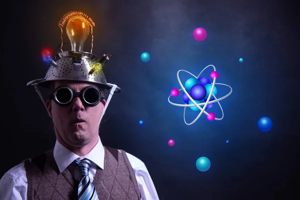 Nerd with tin foil hat presenting Atom icon