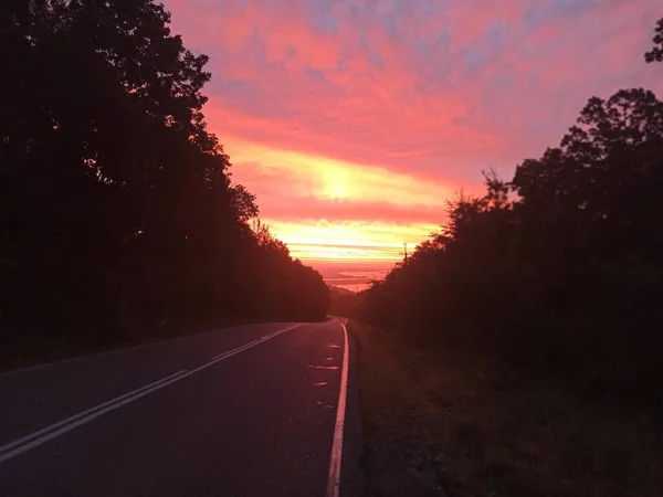 the road and the beautiful sunrise in Russia