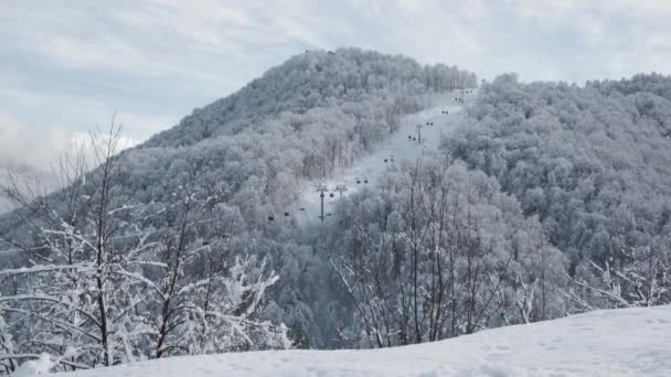 Aerial View Snowy Mountain Ridge Valley Clouds Cable Car Lifting — Stock Video