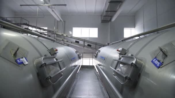 Huge tanks for storing and fermenting milk. Pipeline in modern dairy factory — Stock Video