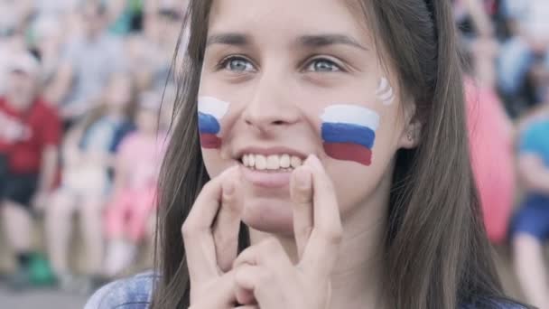 Russian Female football soccer fan cheering at match, supporting football team. Slow motion — Stock Video
