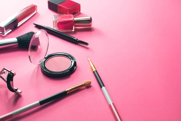 close-up of girl beauty cosmetic fashion makeup mockup product package powder, eyeliner, brush, lipstick set pink background
