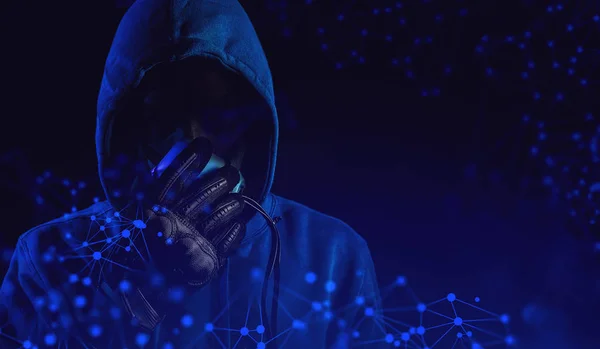 data deep learning, hacker with blue hood outfit and mask with glove on dark background in security virus network and ai hologram robotic concept, futuristic sever online