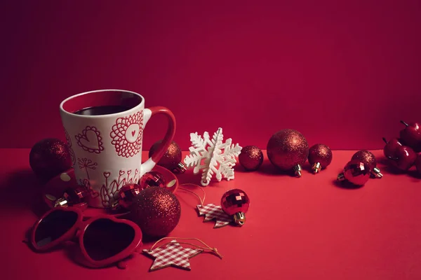 decoration with coffee mug season greeting merry christmas prop on red background