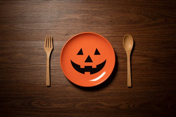 halloween holiday dinner prop decoration with spoon and dish on wood table background