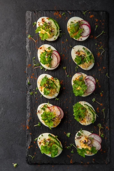 Stuffed Eggs Black Slate Board Top View — Stock Photo, Image