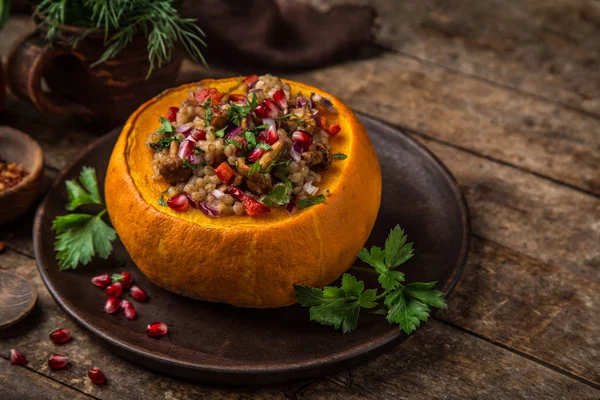 Whole Pumpkin Stuffed Barley Vegetables Served Pomegranate Parsley Rustic Background — Stock Photo, Image