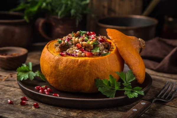 Whole Pumpkin Stuffed Barley Vegetables Served Pomegranate Parsley Rustic Background — Stock Photo, Image