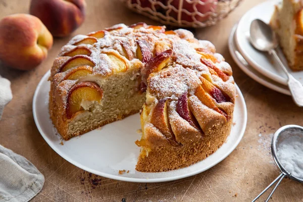 Peach cake  on wooden table — Stock Photo, Image