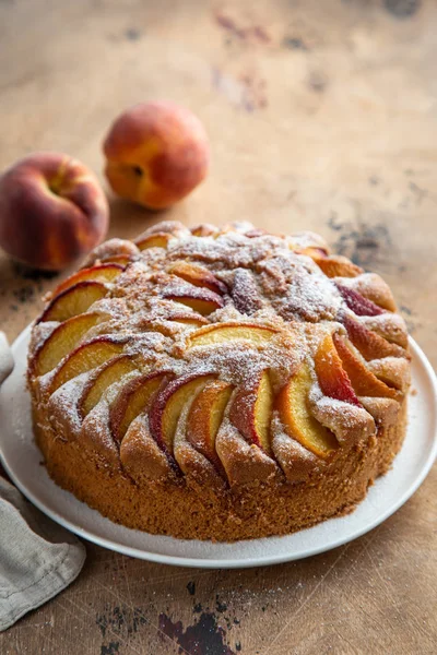 Peach cake  on wooden table — Stock Photo, Image