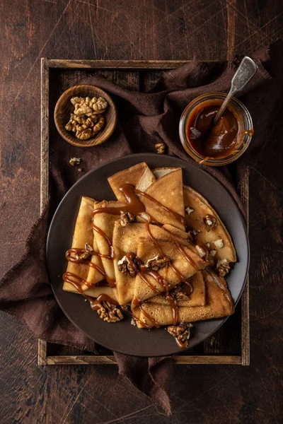 Crepes with salted caramel and nuts — Stock Photo, Image