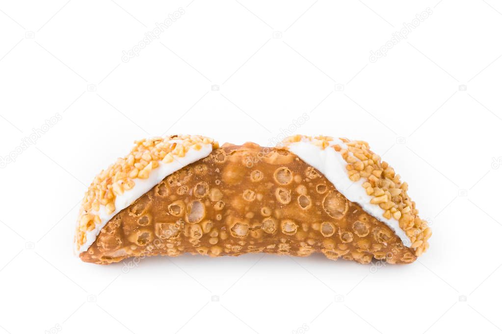 Sicilian cannolo. Traditional Sicilian dessert, filled with a rich ricotta cream  enriched with hazelnut grains.