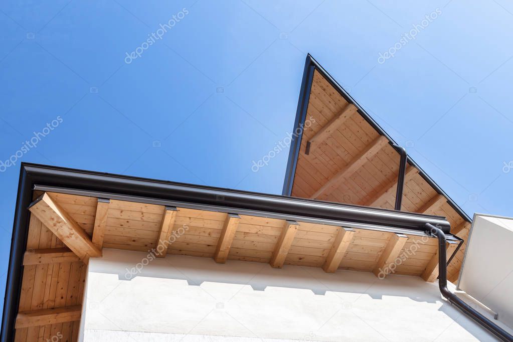 Rain gutter on the roof ecological house