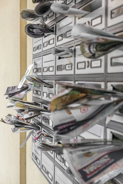 Mail boxes filled of leaflets — Stock Photo, Image
