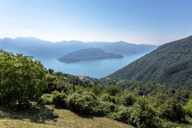 Aerial view of Monte Isola on lake Iseo. Amazing italian landscape. Parzanica (BG), ITALY - July 9, 2020. clipart