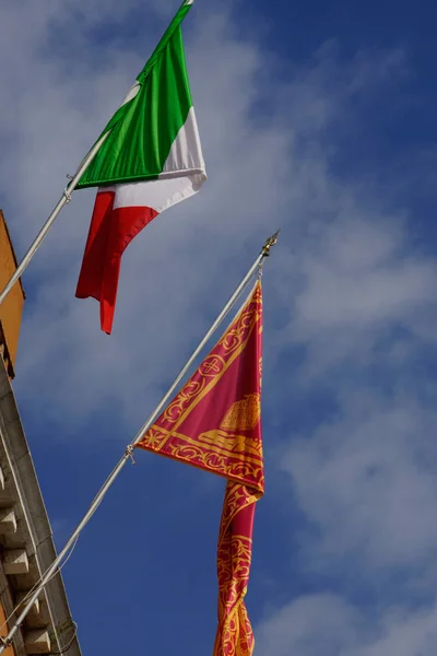 Venice (Italy). Flags of Italy and the city of Venice