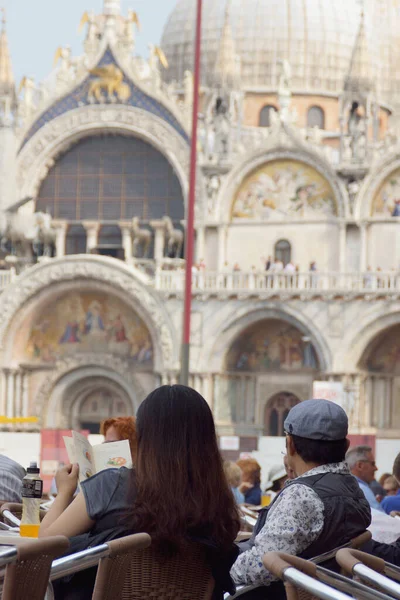 Venice (Italy). Tourists contemplating the Basilica of Saint Mark in the city of Venice