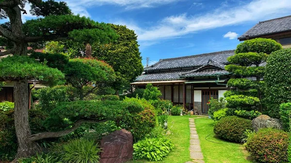 Garden at the entrance of a Japanese house.