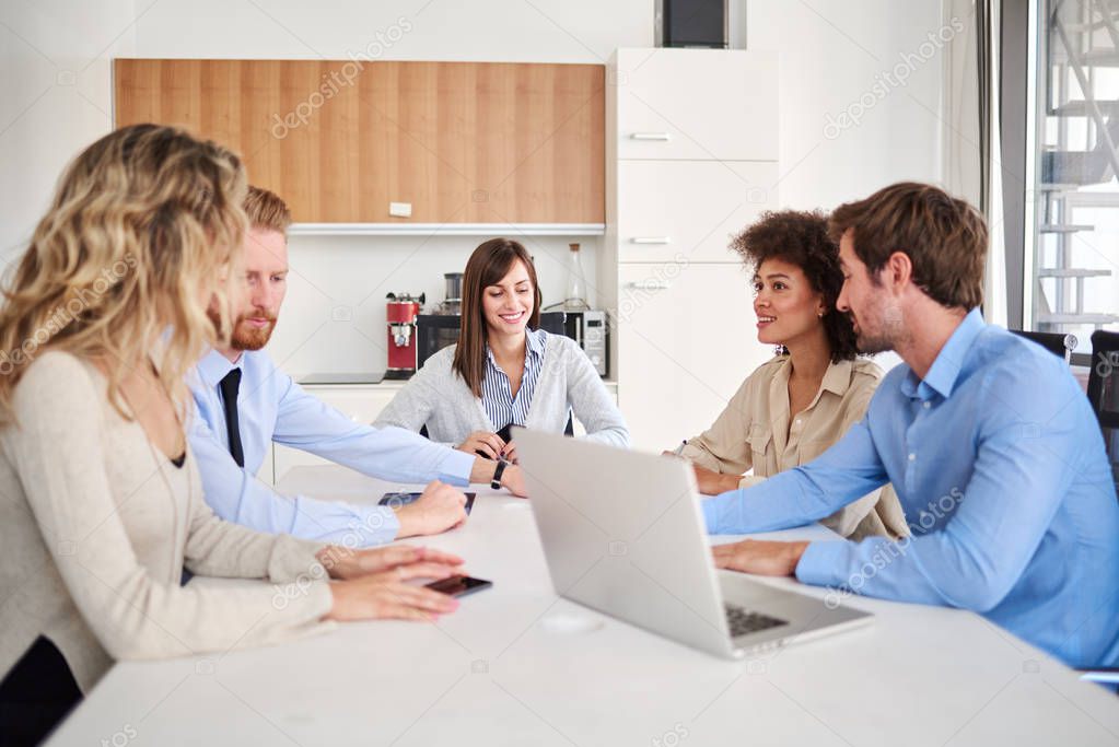 Group of multi ethnic business people posing in office. Start up team on a meeting on their office