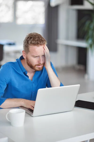 Young serious employee having problems at work. Bad day at work concept. — Stock Photo, Image