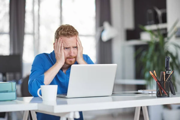 Young serious employee having problems at work. Bad day at work concept. — Stock Photo, Image