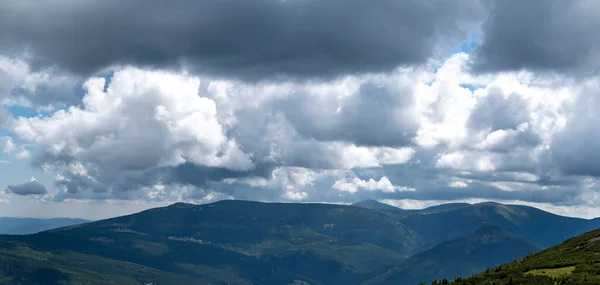 Mountain with clouds in the Giant Mountains in summer