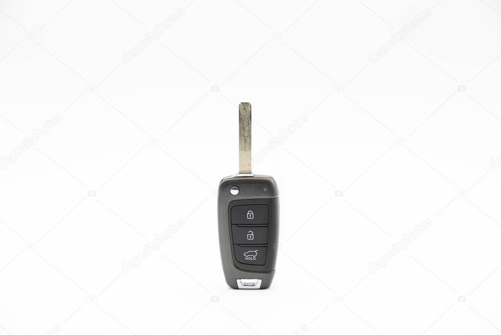 Electronic car key with buttons for remote opening and unlocking isolated on white background.