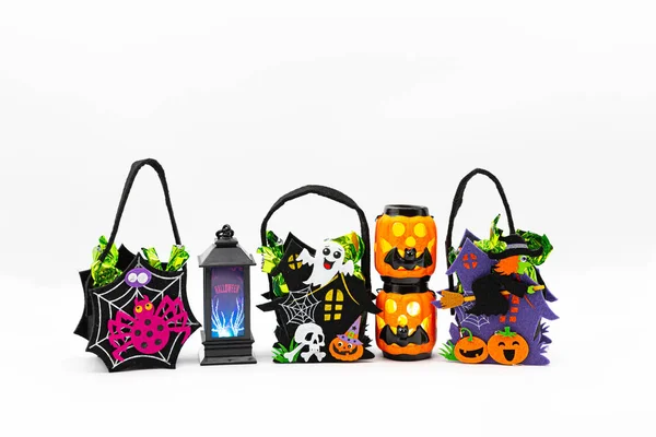 Halloween Candy Bags Cute Felt Pouches with Handles, Trick or Treat Goody Bags on white background.