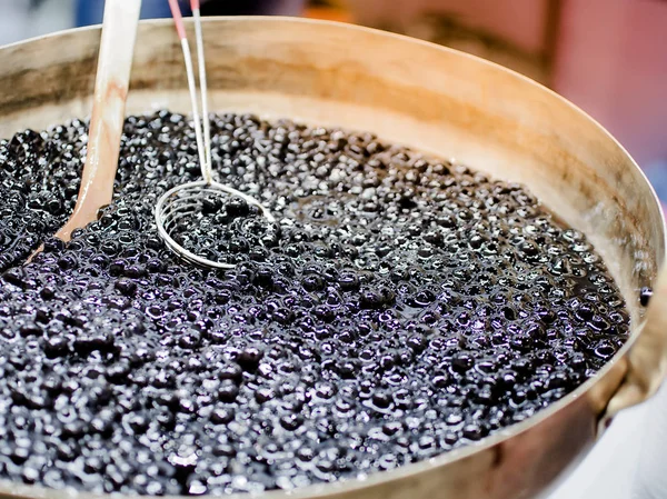 Tapioca ball or boba for bubble tea in brass pan. boba is ingredients for making pearl milk tea. Beverage food image. Selective focus