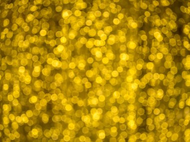 Bulanık arkaplan bulanıklaştırılmış bulanıklaştırılmış bulanıklaştırılmış bokeh. Şenlikli altın ışıklar..