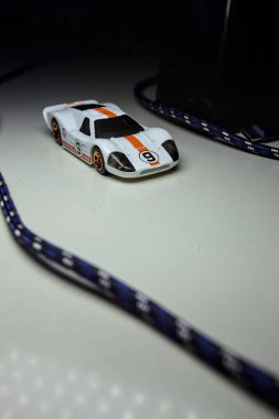 Mantova, Italy - 10TH AUGUST 2025 - Hot Wheels replica of a 1967 Ford GT40 MK IV pretending to make a curve during a race on a circuit