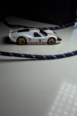 Mantova, Italy - 10TH AUGUST 2025 - Hot Wheels replica of a 1967 Ford GT40 MK IV pretending to make a curve during a race on a circuit