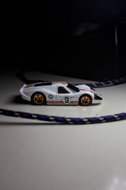 Mantova, Italy - 10TH AUGUST 2025 - Hot Wheels replica of a 1967 Ford GT40 MK IV pretending to make a curve during a race on a circuit