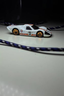 Mantova, Italy - 10TH AUGUST 2025 - Hot Wheels replica of a 1967 Ford GT40 MK IV pretending to make a curve during a race on a circuit