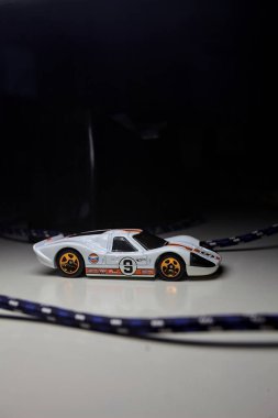 Mantova, Italy - 10TH AUGUST 2025 - Hot Wheels replica of a 1967 Ford GT40 MK IV pretending to make a curve during a race on a circuit