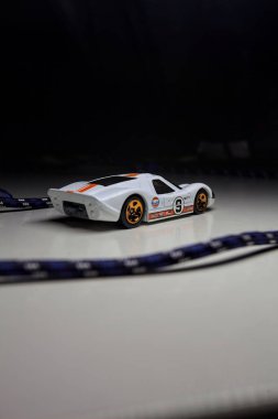 Mantova, Italy - 10TH AUGUST 2025 - Hot Wheels replica of a 1967 Ford GT40 MK IV pretending to make a curve during a race on a circuit